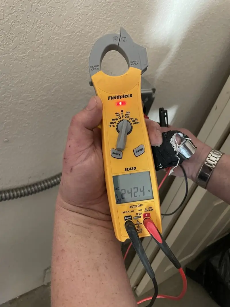 Voltage testing with clamp meter during Generator Installation in Winslow